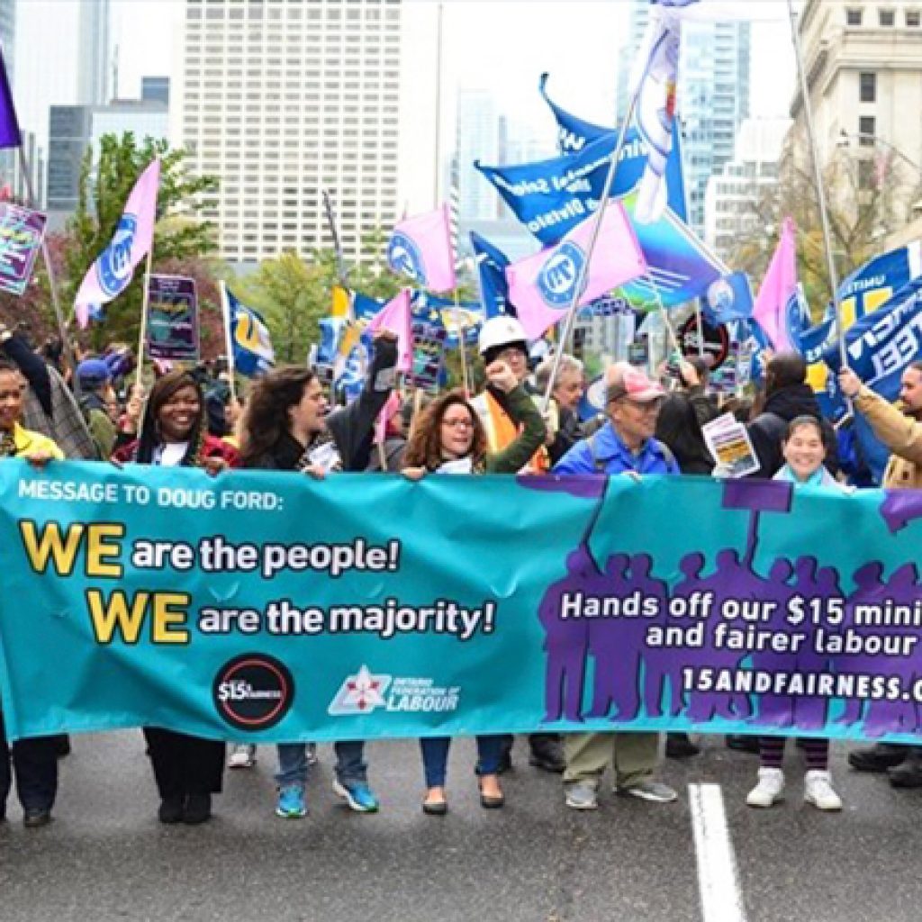 Protesters urge Ford to keep worker protections, minimum wage bump in place